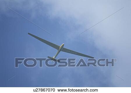 Stock Image - Glider Which Flies In The Sky. Fotosearch