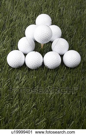 Stock Image - Golf Balls on Grass. Fotosearch