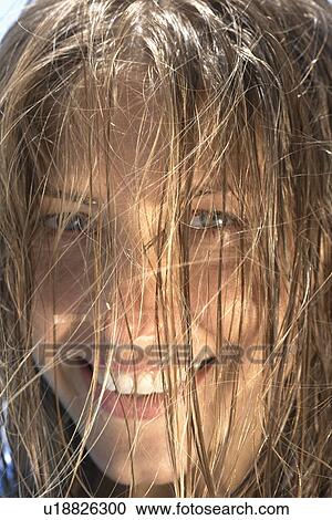 Stock Image - Hair covering woman's face. Fotosearch