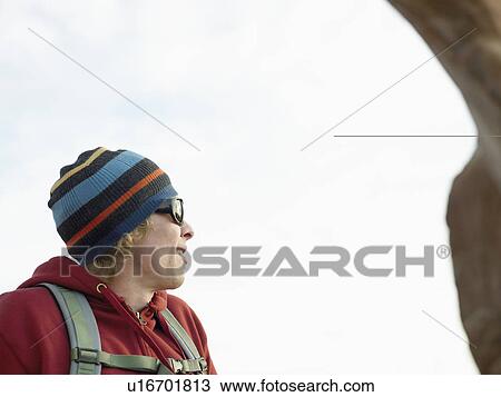 Stock Image - Hiker looking at view. Fotosearch