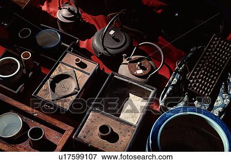 Stock Photo - Iron Kettles And Drawers. Fotosearch