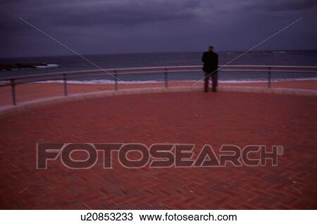 Stock Image - Man Looking At Sea. Fotosearch
