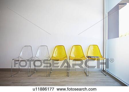 Stock Photo - Plastic chairs in lobby. Fotosearch