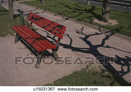 Stock Photo - The Red Bench In A Park. Fotosearch