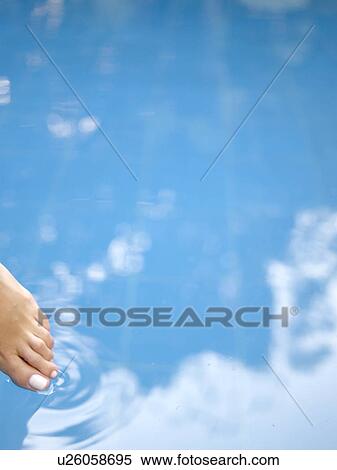 Toe dipping in water (close-up) View Large Photo Image Stock Photography - Toe dipping in water (close-up). Fotosearch