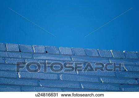 Stock Image - Blue Brick Wall From Below. Fotosearch