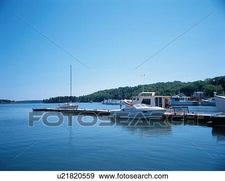Stock Photo - Boats On Jetty. Fotosearch