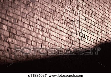Stock Photo - Brick Wall In Shadow. Fotosearch