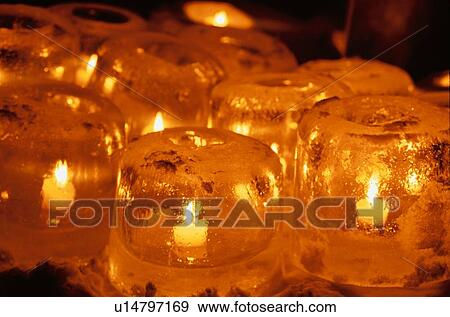 Stock Photo - Candles In Ice Lanterns. Fotosearch
