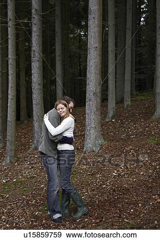 Couple Hugging in Forest View Large Photo Image Stock Photo - Couple Hugging in Forest. Fotosearch