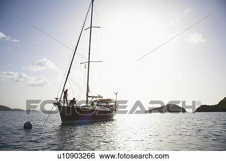 Couple on sailboat, St. John, US Virgin Islands, USA View Large Photo Image Stock Photograph - Couple on sailboat, St. John, US Virgin Islands, USA. Fotosearch