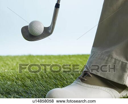 Stock Photo - Golf Player Hitting Ball. Fotosearch