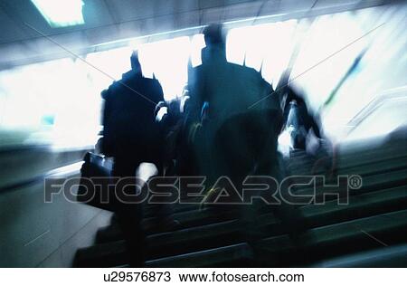 Stock Image - Men Running Up Stairs. Fotosearch