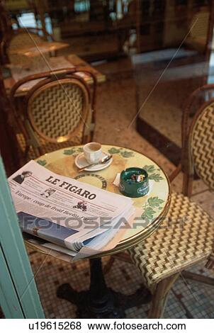 Stock Photo - Newspaper On Cafe Table. Fotosearch