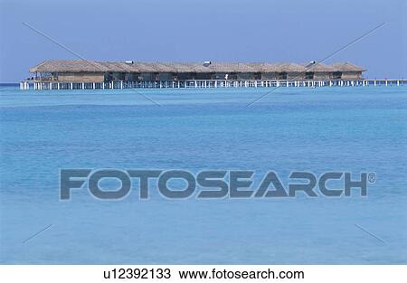 Stock Image - The Cottage And The Sea. Fotosearch
