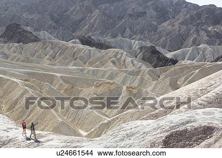Picture - Two hikers in desert (high angle view), Death Valley, California, USA. Fotosearch