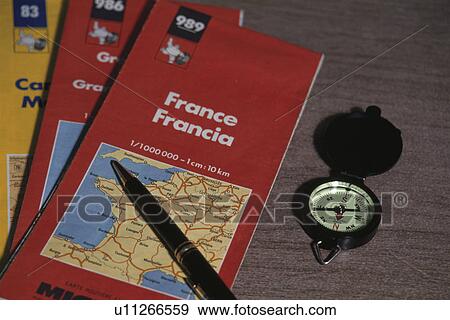 Stock Photo - A Map, A Magnet, And A Pen. Fotosearch