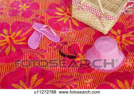 Beach attire on picnic blanket View Large Photo Image Stock Photo - Beach attire on picnic blanket. Fotosearch