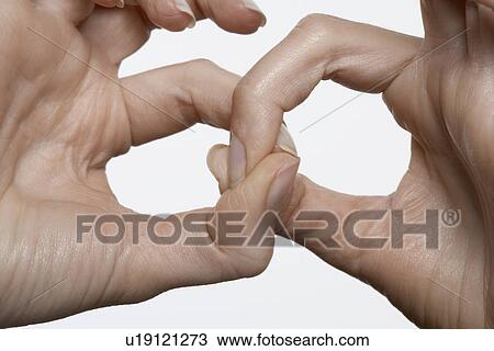 Stock Image - Fingers linked, close-up. Fotosearch