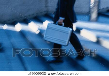 Stock Image - Man Walking Down Steps. Fotosearch