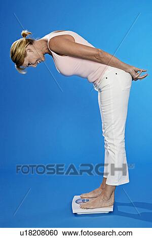Mature Woman on Bathroom Scale View Large Photo Image Stock Image - Mature Woman on Bathroom Scale. Fotosearch