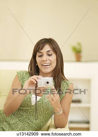 Mid-Adult Woman Using Digital Camera View Large Photo Image Stock Photo - Mid-Adult Woman Using Digital Camera. Fotosearch