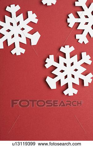 Paper snowflakes on red background (close-up) View Large Photo Image Stock Photo - Paper snowflakes on red background (close-up). Fotosearch