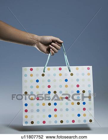 Person Holding Shopping Bag View Large Photo Image Stock Image - Person Holding Shopping Bag. Fotosearch
