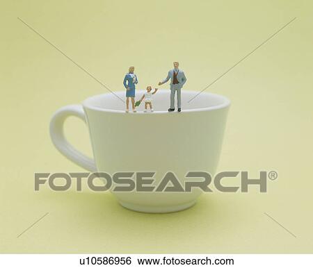 Plastic Family Standing On Cup View Large Photo Image Stock Photograph - Plastic Family Standing On Cup. Fotosearch