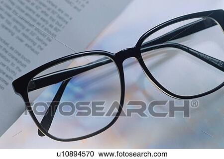 Reading Glasses Near Book View Large Photo Image Stock Image - Reading Glasses Near Book. Fotosearch