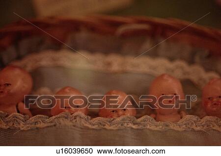 Stock Image - Row Of Dolls. Fotosearch