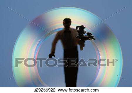 Stock Image - Silhouetted Waiter. Fotosearch