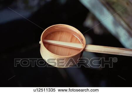 Stock Photography - Water In Wooden Scoop. Fotosearch