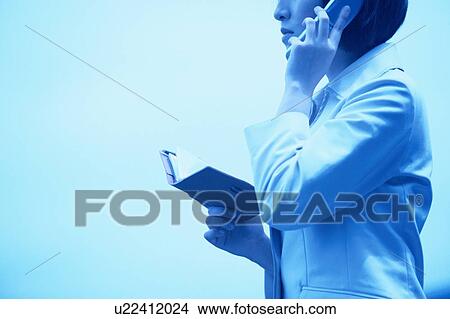 Picture - Woman On Cellphone. Fotosearch