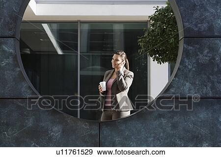 Stock Photo - Businesswoman talking on phone. Fotosearch