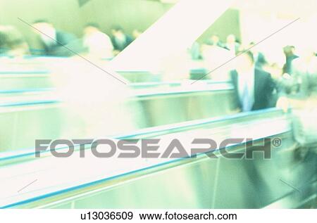 Stock Photo - Commuters On Escalator. Fotosearch