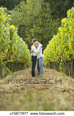 Stock Photo - Couple hugging in vineyard, Napa Valley, California, USA. Fotosearch
