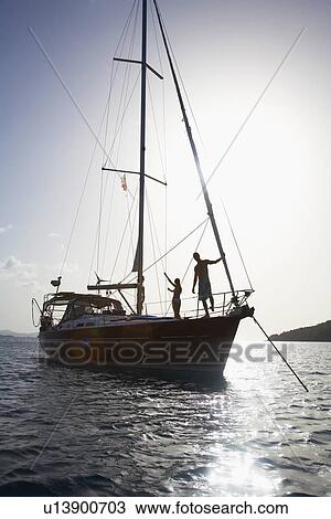Couple on sailboat, St. John, US Virgin Islands, USA View Large Photo Image Stock Image - Couple on sailboat, St. John, US Virgin Islands, USA. Fotosearch