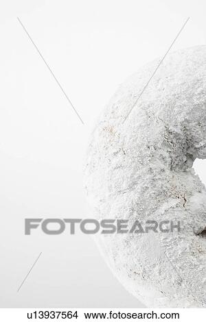 Donut with icing sugar (close-up) View Large Photo Image Picture - Donut with icing sugar (close-up). Fotosearch