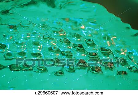 Stock Photo - Ice With Concave Circles. Fotosearch