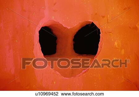 Stock Image - Love Heart Ice Window In Red. Fotosearch