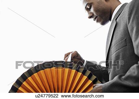 Mid Adult Man Going Through Rotary File View Large Photo Image Stock Image - Mid Adult Man Going Through Rotary File. Fotosearch