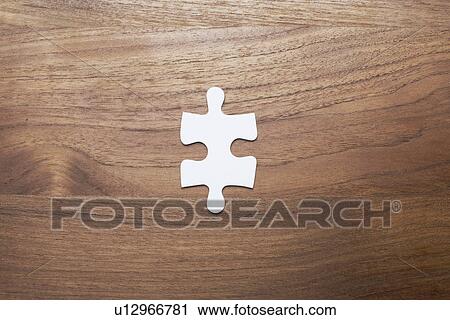 Single jigsaw puzzle piece on wooden background View Large Photo Image Stock Image - Single jigsaw puzzle piece on wooden background. Fotosearch