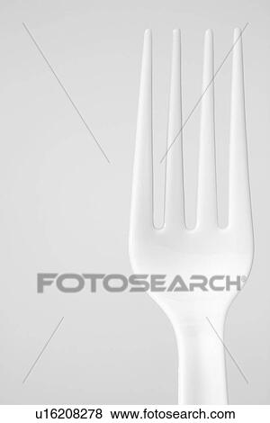 Single plastic fork (close-up) View Large Photo Image Stock Photo - Single plastic fork (close-up). Fotosearch