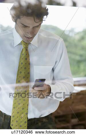 Stock Photograph - Young man using businessman. Fotosearch