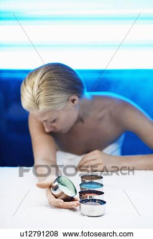 Young woman with lotions in bowls View Large Photo Image Stock Photo - Young woman with lotions in bowls. Fotosearch