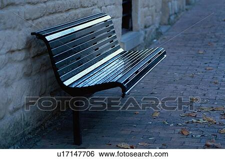 Stock Photograph - Bench By Stone Wall. Fotosearch