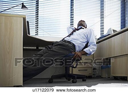 Bored Mid Adult Man Doing Paperwork View Large Photo Image Stock Photo - Bored Mid Adult Man Doing Paperwork. Fotosearch