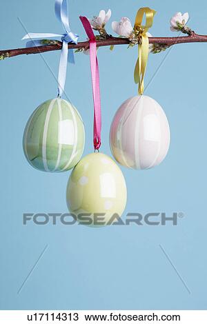 Ceramic Easter eggs on Cherry blossom branch (close-up) View Large Photo Image Stock Image - Ceramic Easter eggs on Cherry blossom branch (close-up). Fotosearch