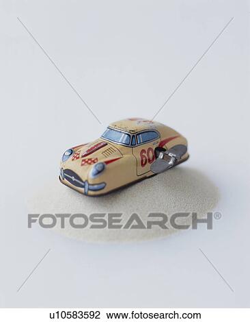 Stock Image - Clockwork Car On Sand. Fotosearch